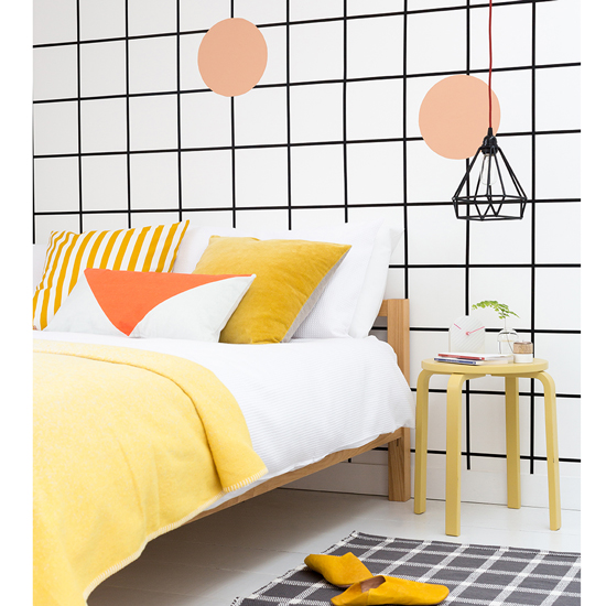 bold paint design with rug and wooden stool