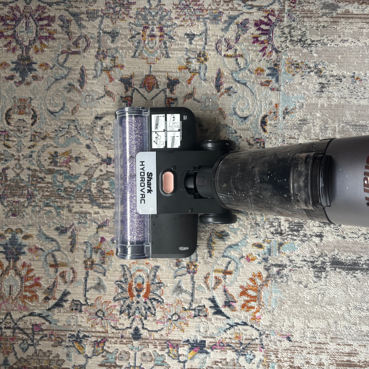 Shark HydroVac Cordless Hard Floor Cleaner in use on patterned low-pile rug