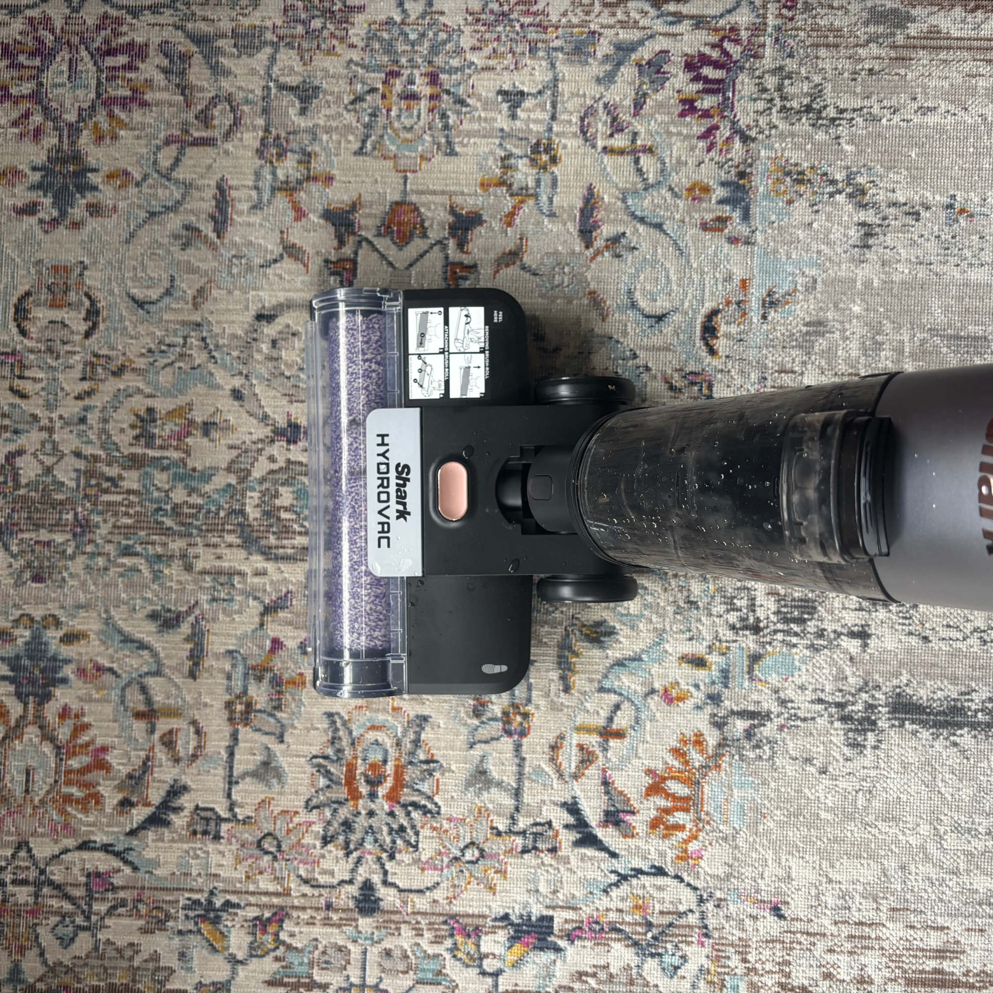  Shark HydroVac Cordless Hard Floor Cleaner in use on patterned low-pile rug