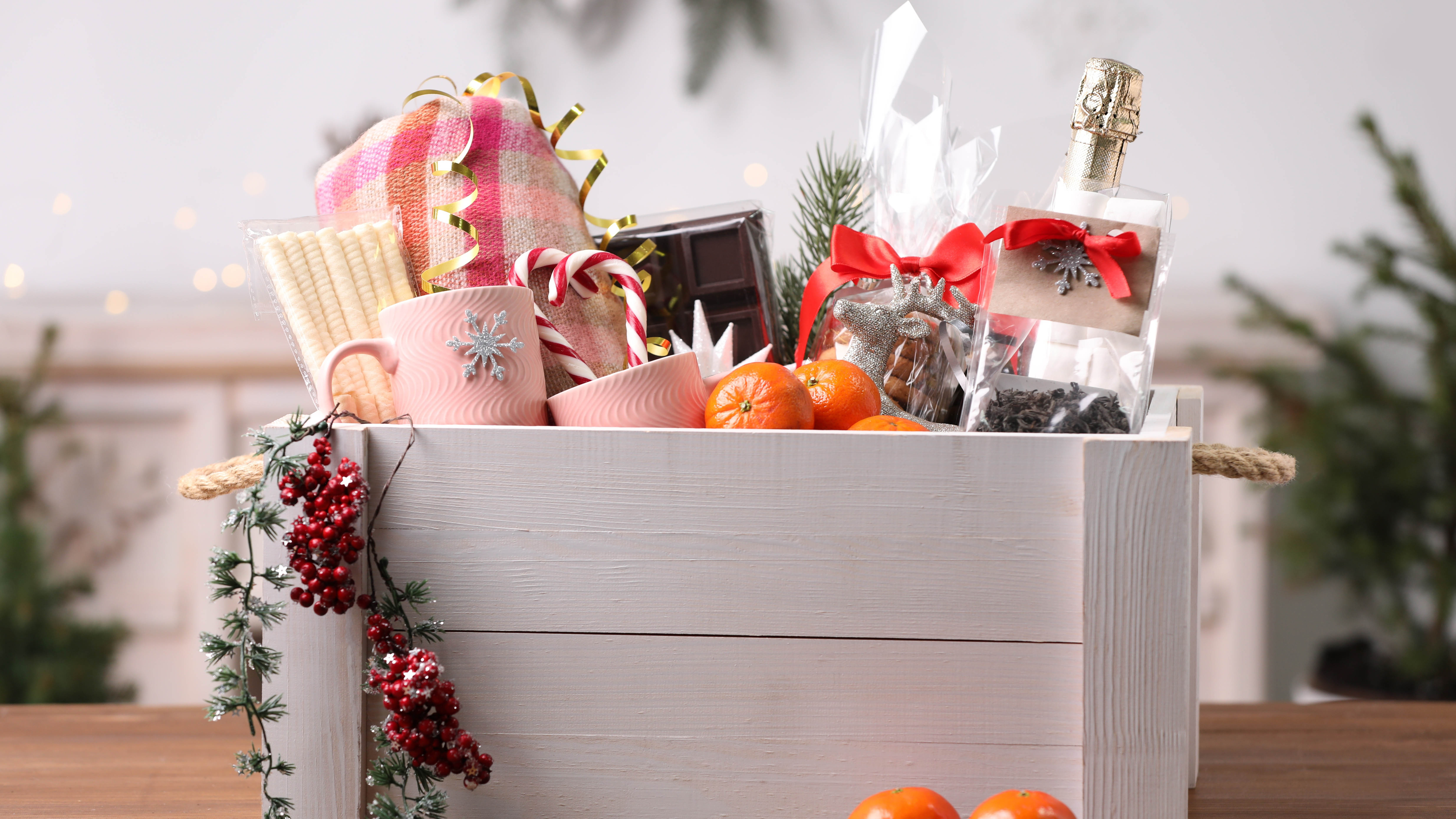 White wooden crate full of Christmas gifts