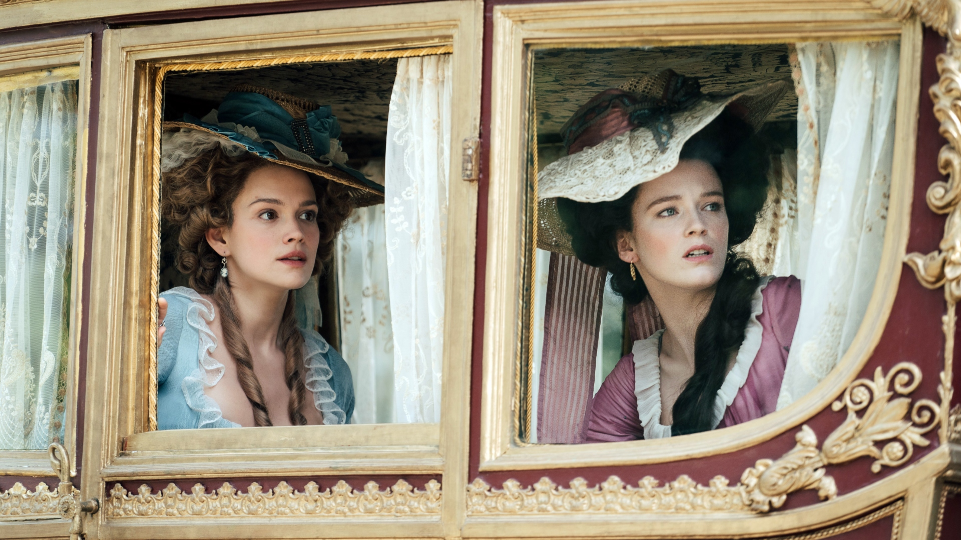 Marie and Yolande look out the carriage windows in Marie Antoinette