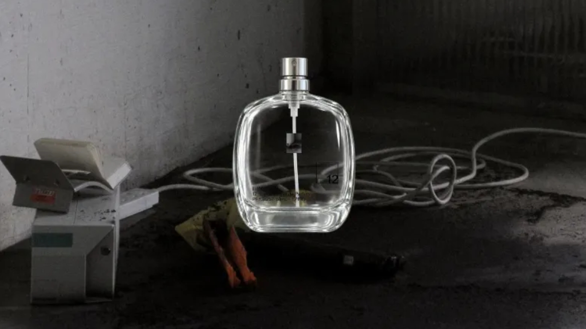 12 Things perfume bottle on background of decay and destruction