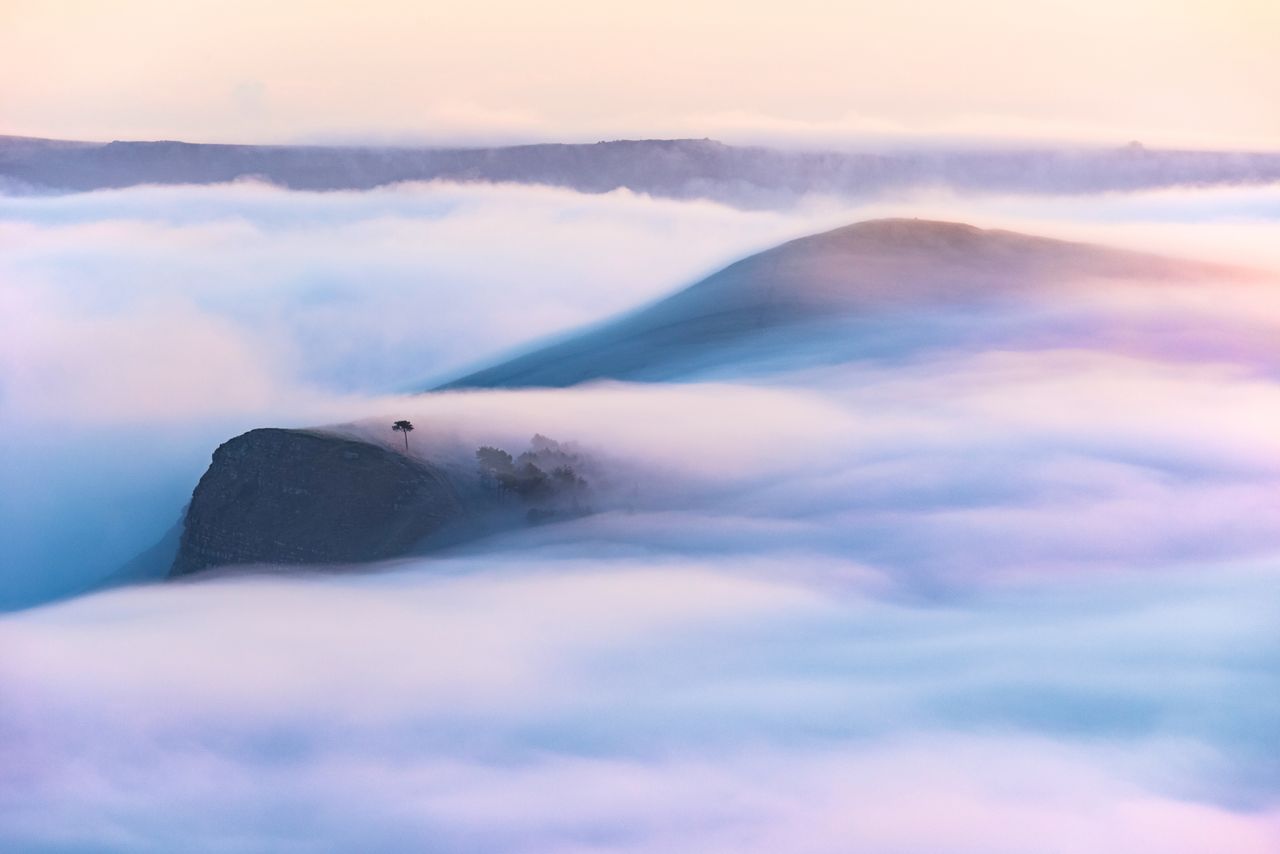 Fog swallows sound, muffling Lose Hill and Back Tor in the wintry Peak District.