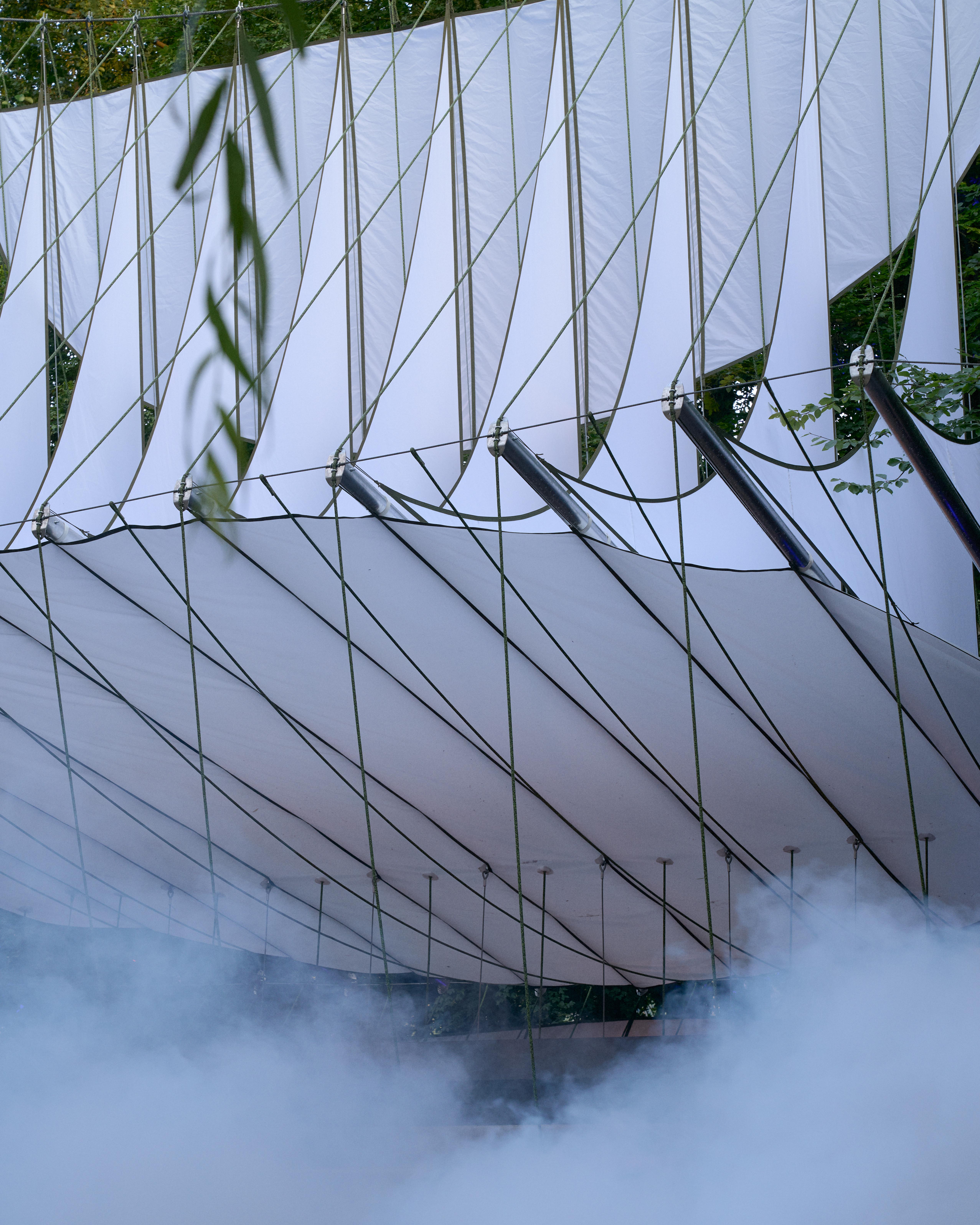 At Dekmantel Festival, a white tent over a stage in the woods