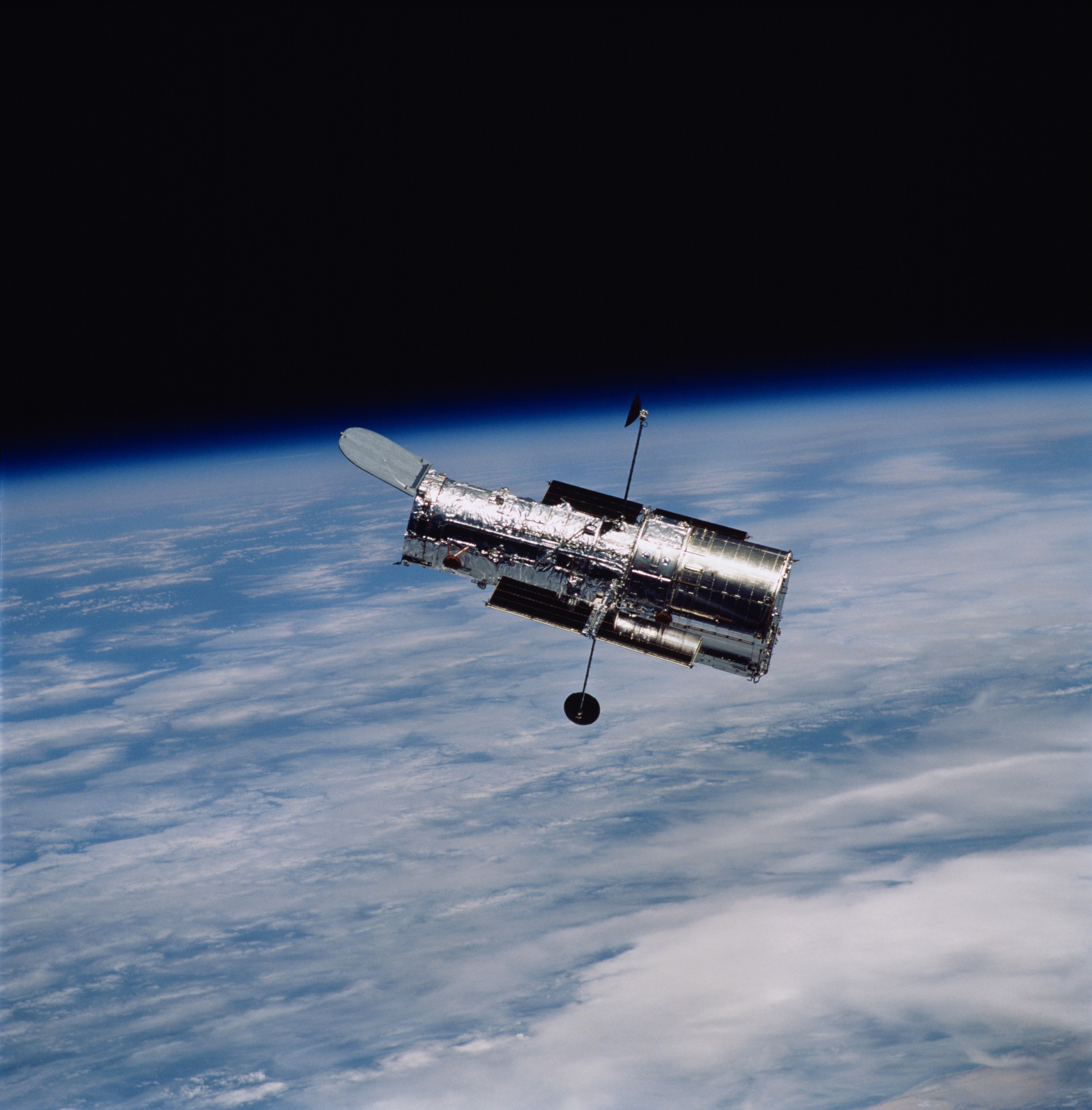The Hubble Space Telescope is in orbit above Earth