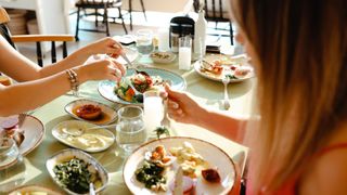 Friends enjoying a meze spread at home