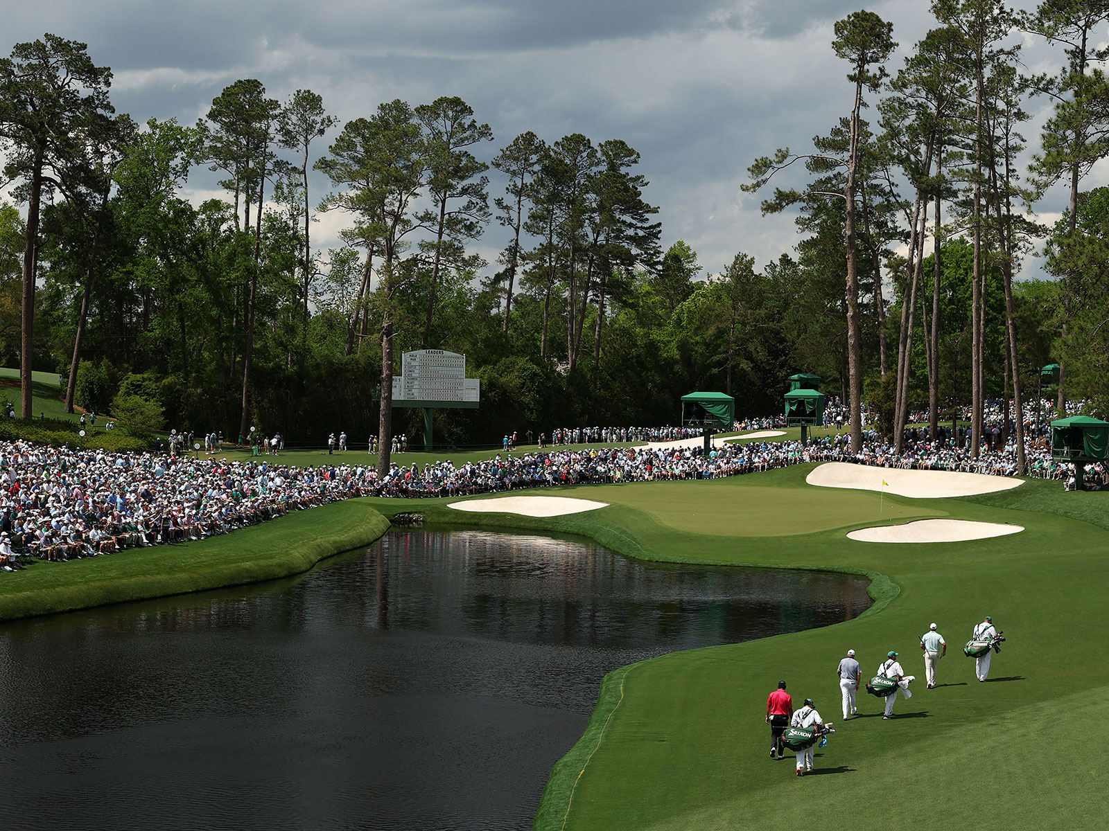 players walk up to the 16th green at Augusta National
