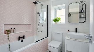 small bathroom with pink wall tiles