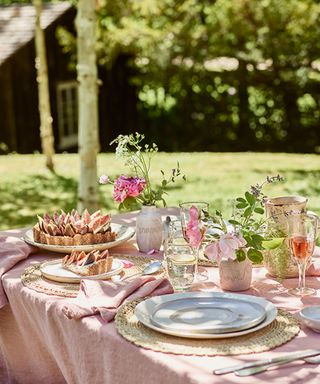 garden table laid with pink accessories