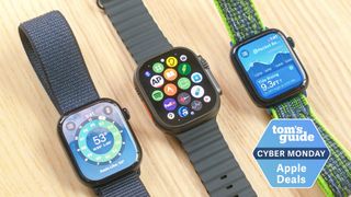 Apple Watch SE 2022 Series 10 and Ultra 2 on a table with the Tom's Guide Cyber Monday deal badge