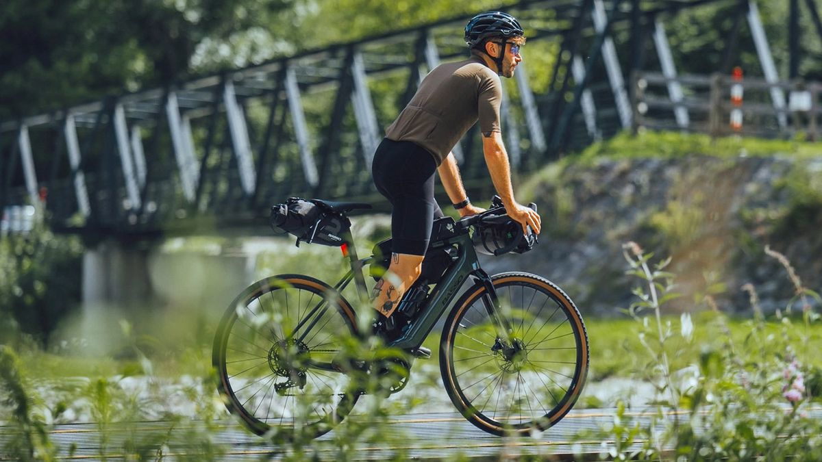 Man cycling along wooded trail on Basso Bikes Volta e-bike