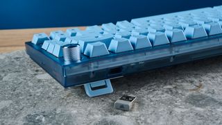 A glacier blue Corsair K65 Plus wireless mechanical keyboard for Mac