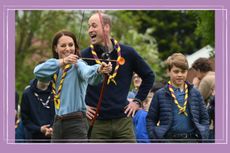 Prince William, Catherine, Princess of Wales, and Prince George try their hands at archery at a Scout event to celebrate the coronation of King Charles III