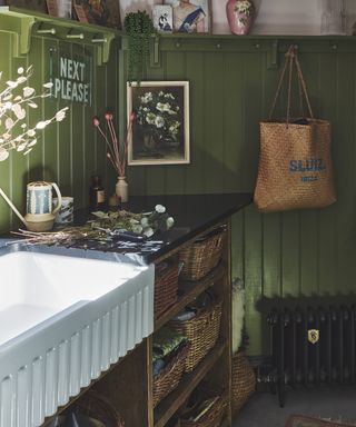 green laundry with white belfast sink