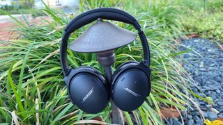 The Bose QuietComfort 45 hanging off a lamp post