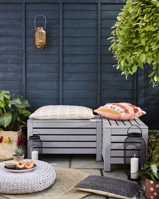 upcycled garden storage bench painted a pale grey