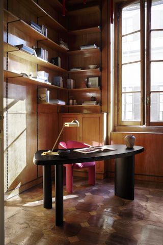 Black desk by Charlotte Perriand, among design reissues