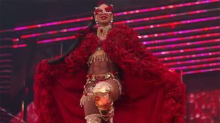 Bianca's war of the roses red cape and gold gear at Wrestlemania 2025. 