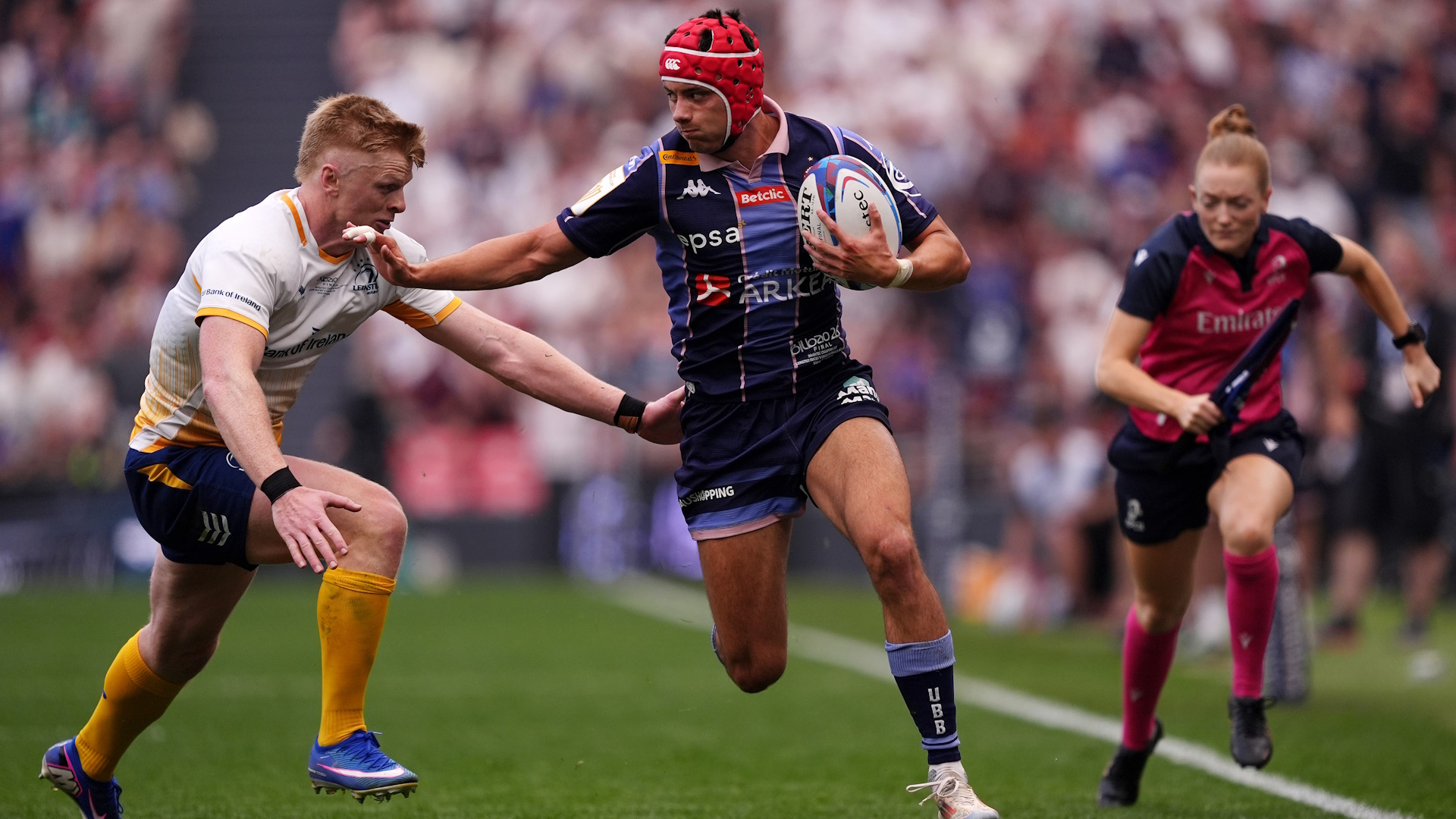 Louis Bielle-Biarrey of Union Bordeaux Begles evades the tackle of Tommy O'Brien of Leinster during the a Champions Cup rugby union match.