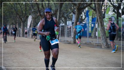 Donna McConnell running a race as part of her triathlon training, laughing and smiling looking at the camera