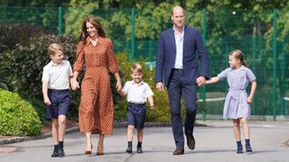 Prince George, Princess Charlotte and Prince Louis (C), accompanied by their parents the Prince William and Kate Middleton as they arrive for a settling in afternoon at Lambrook School, near Ascot on September 7, 2022 in Bracknell, England.