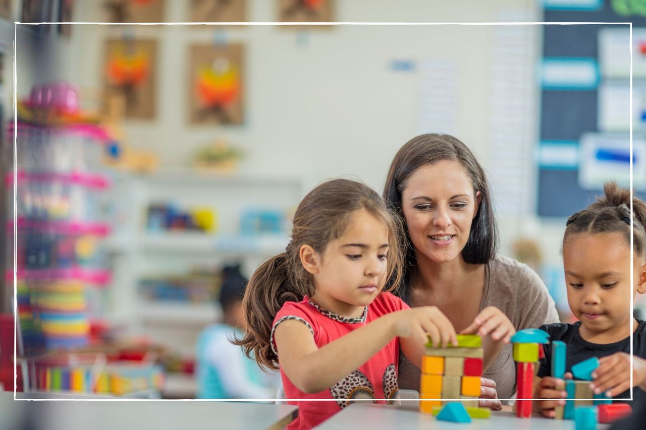 nursery worker watching children as they play with blocks and build structures at nursery