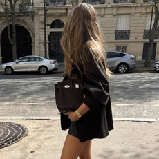 woman wearing knee high brown suede boot trend