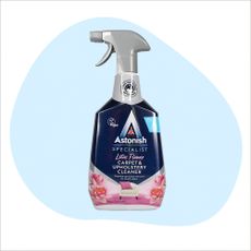 Astonish upholstery cleaner bottle on a blue and white background