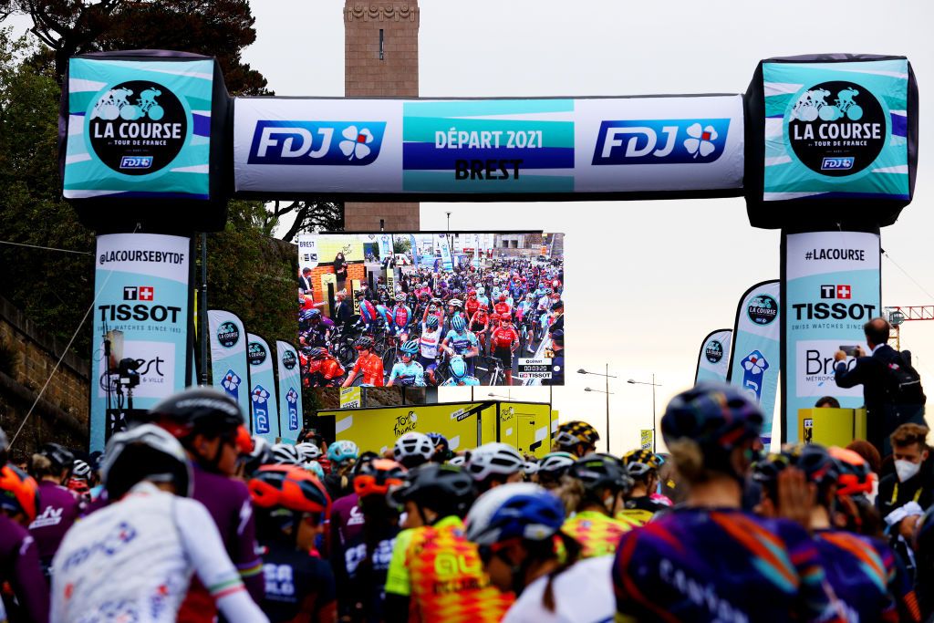 LANDERNEAU FRANCE JUNE 26 The peloton at start in Brest during the 8th La Course By Le Tour De France 2021 a 1077km race from Brest to Landerneau Cte De La Fosse Aux Loups 176m Landscape LaCourse LeTour TDF2021 UCIWWT on June 26 2021 in Landerneau France Photo by Tim de WaeleGetty Images