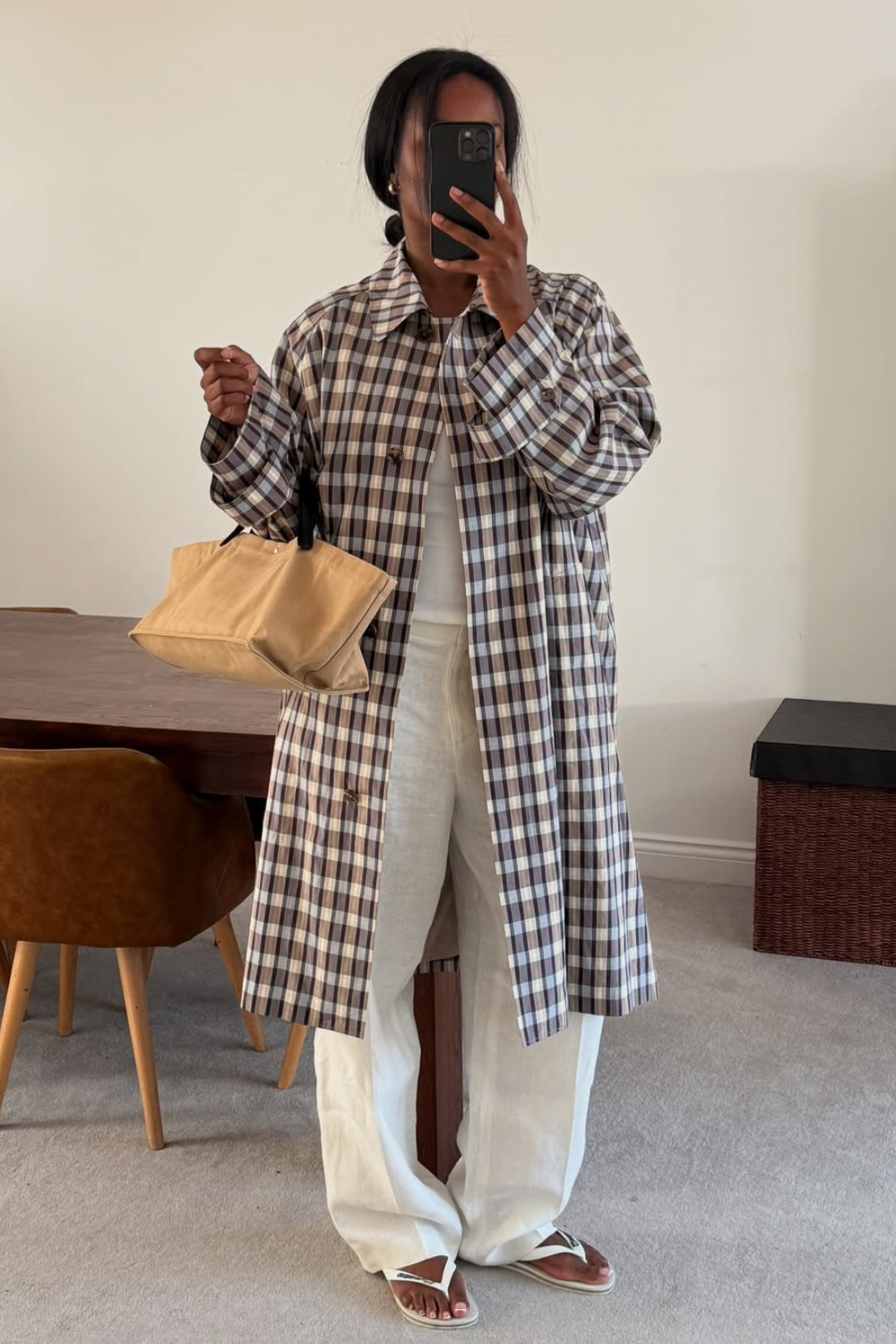 @nlmarilyn wears all-white outfit and gingham coat