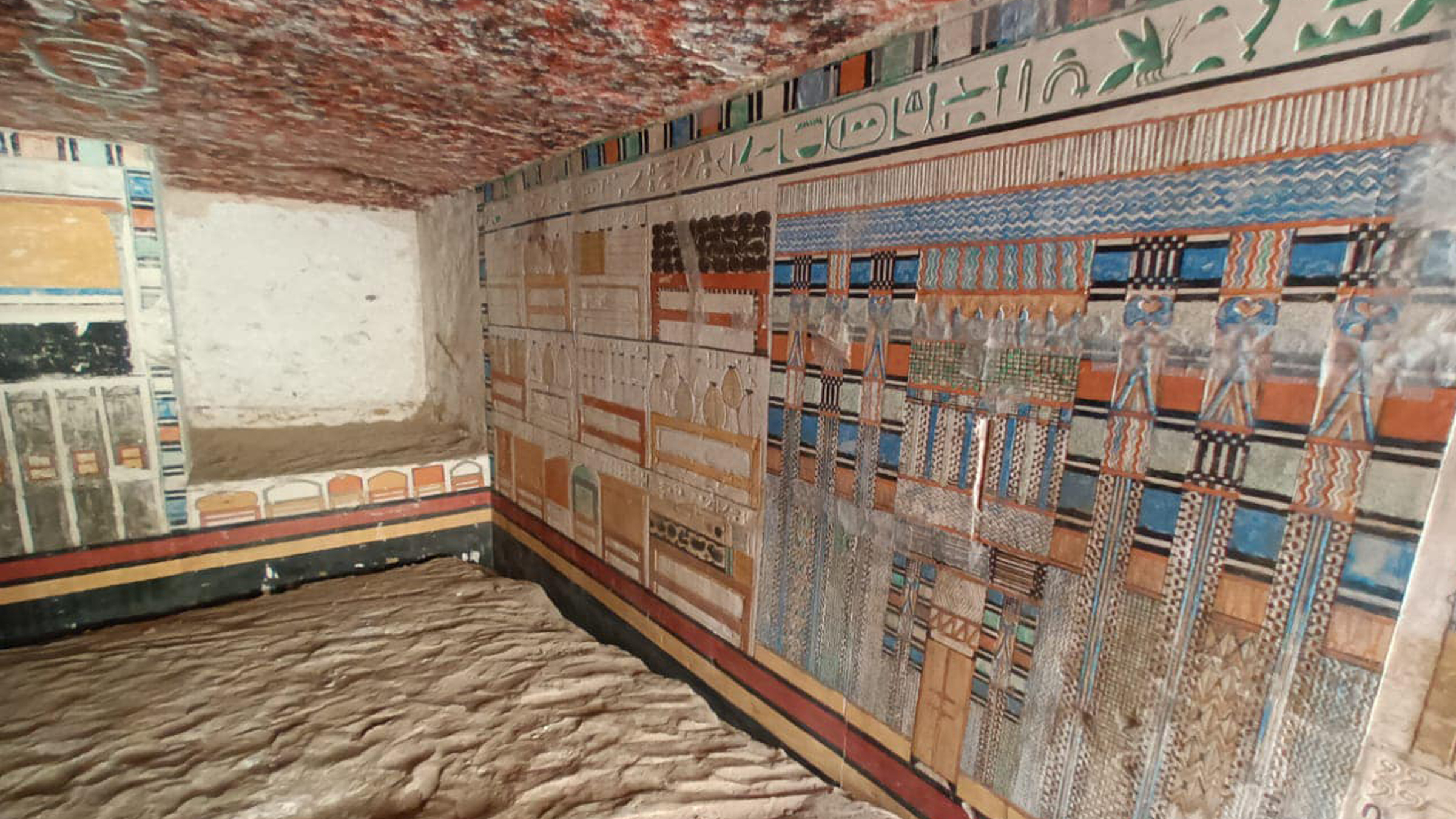 A geometric and hieroglyphic wall painting in a tomb