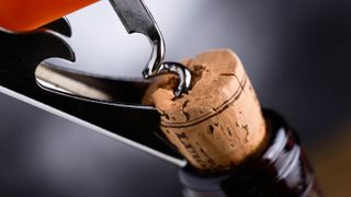 Removing cork from bottle