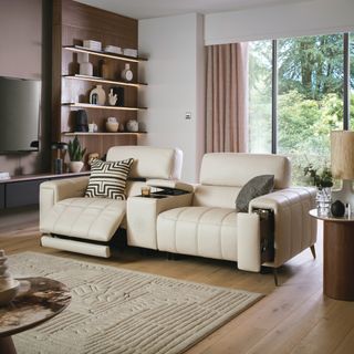 DFS Cinesound Showcase reclining sofa in cream in a living room