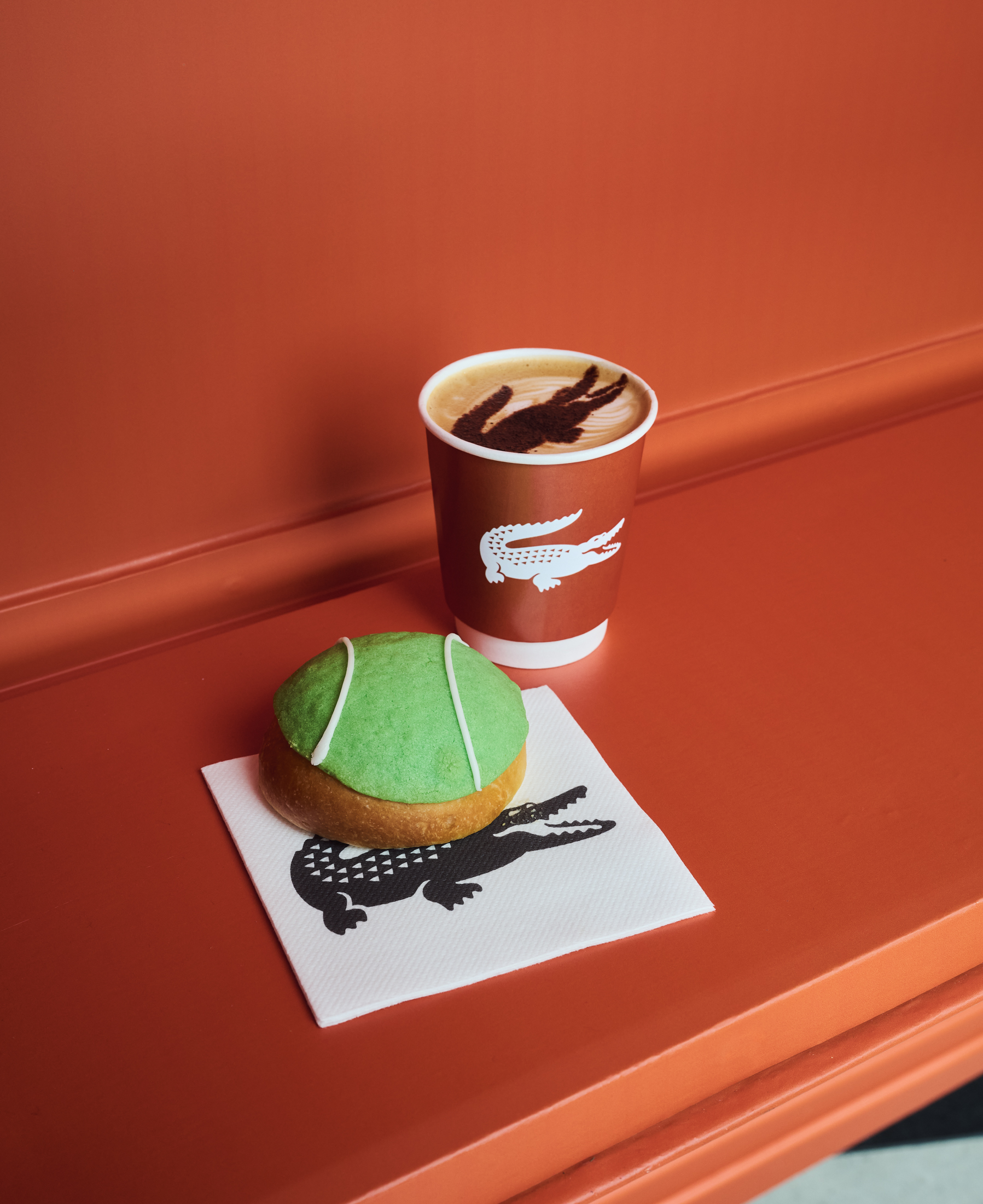 a tennis themed biscuit and coffee at the lacoste pop-up in selfridges