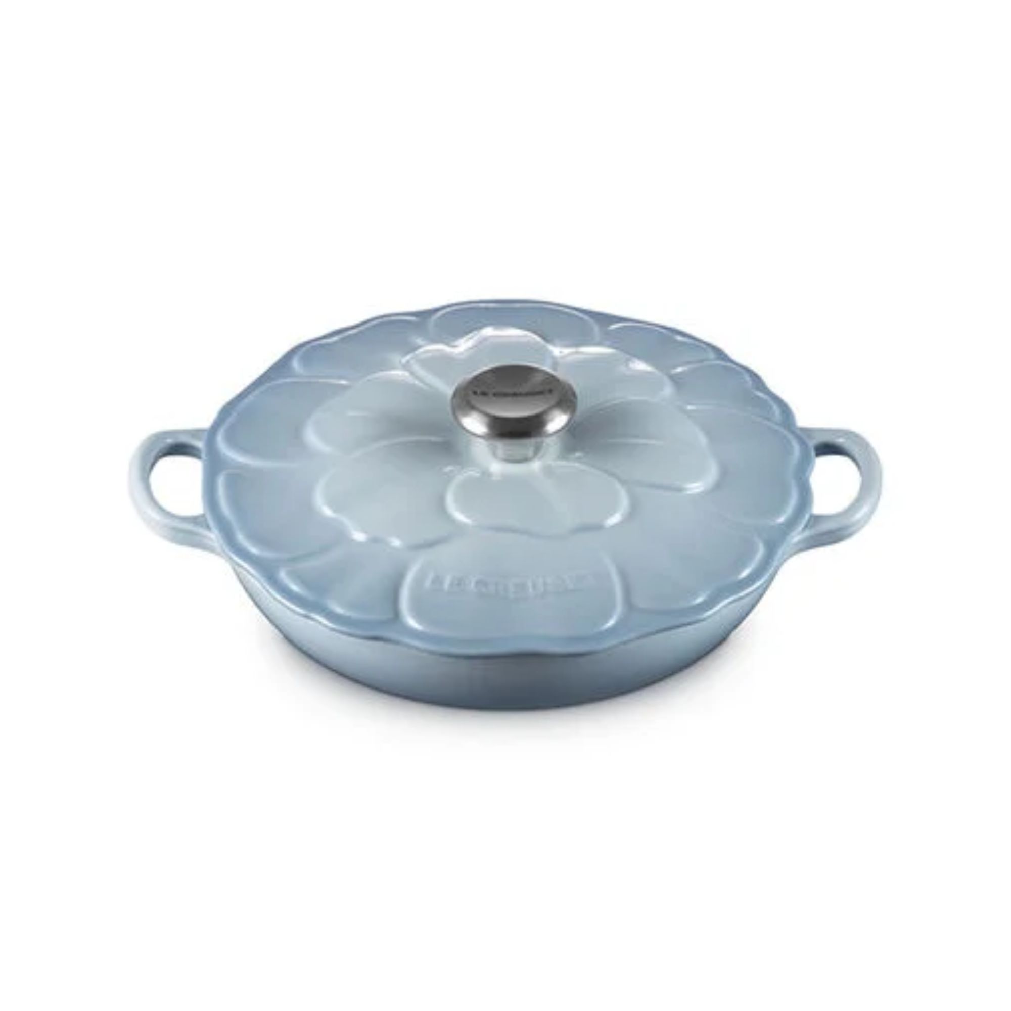 A blue petal embossed braiser on a white background