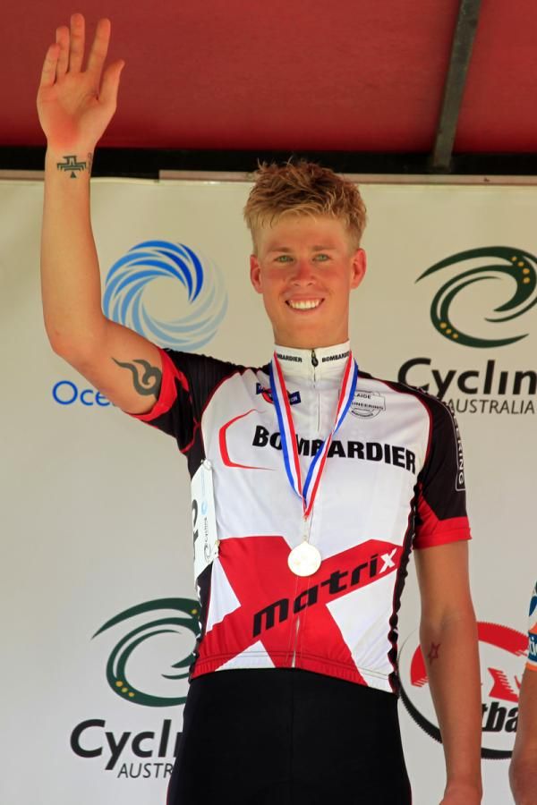 Ryan Obst stands victorious on the podium