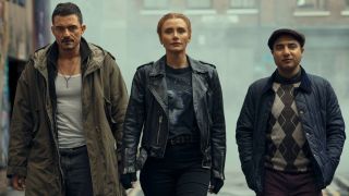 A still from the Prime Video movie Deep Cover showing Bryce Dallas Howard, Orlando Bloom and Nick Mohammed