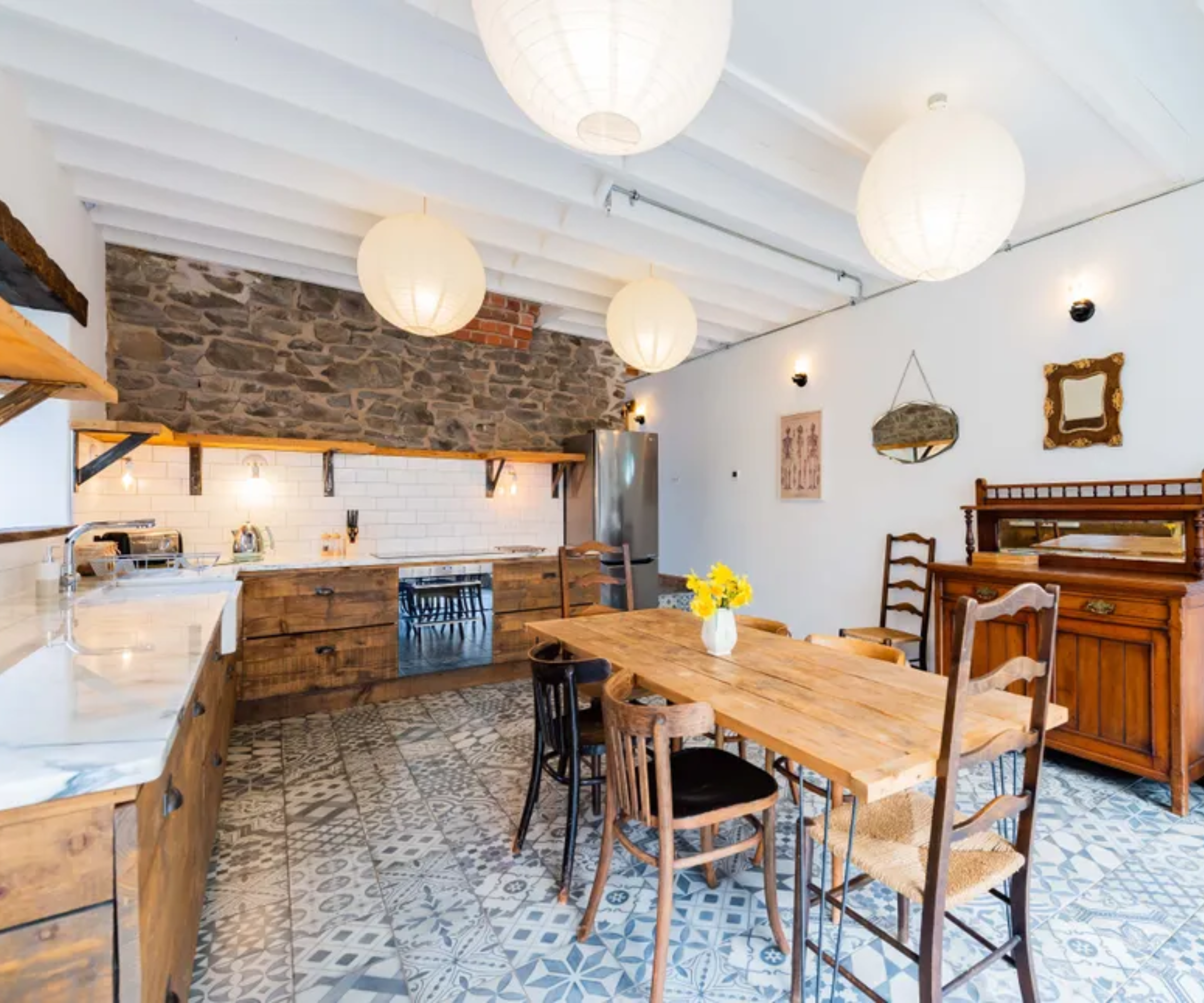 kitchen in barn conversion with layered lighting