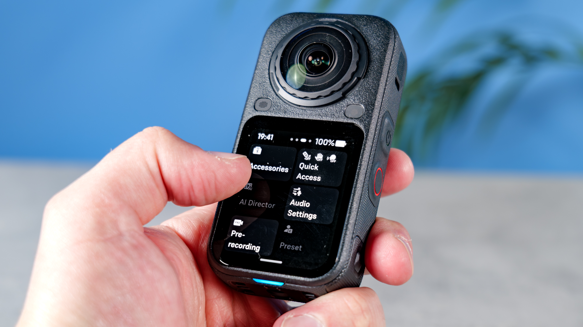 A photo of the Insta360 X6 in hand the with menus being browsed