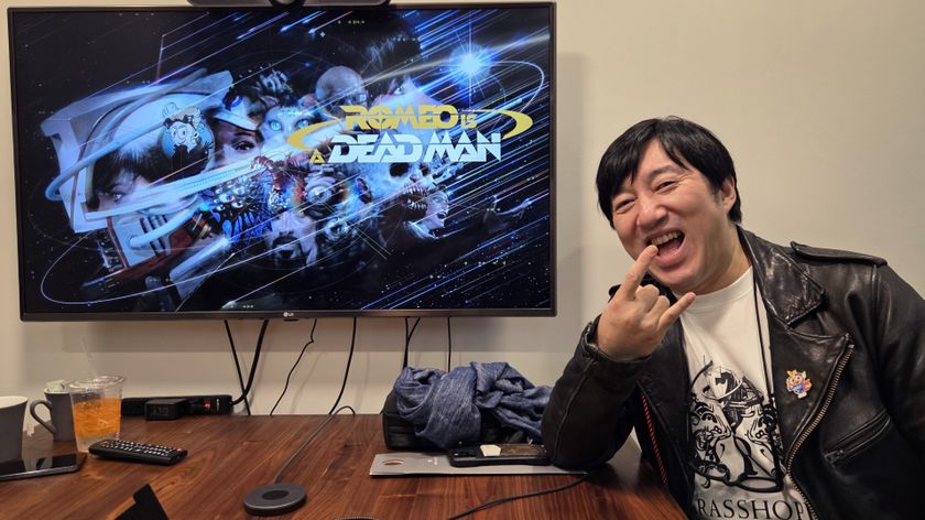 Suda51 posing in front of a TV showing Romeo Is a Dead Man