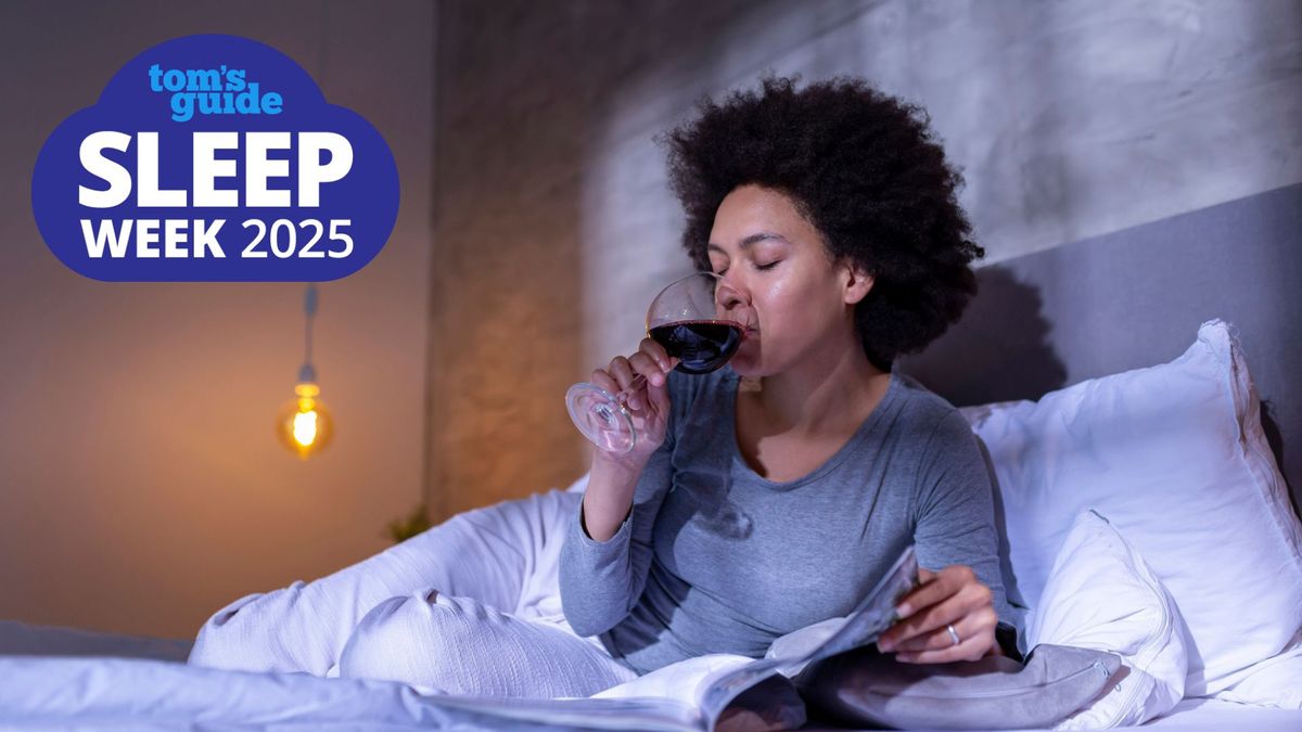 A woman lying in bed reading a book and sipping a glass of red wine, with the Tom&#039;s Guide Sleep Week 2025 logo in the top left corner