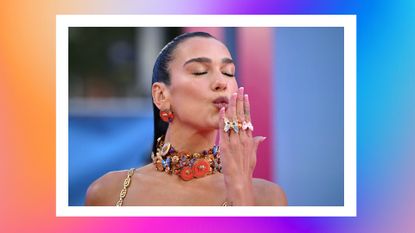 English singer-songwriter Dua Lipa blows a kiss on the pink carpet upon arrival for the European premiere of "Barbie" in central London on July 12, 2023. 