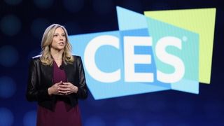 A keynote speaker on stage in front of a CES logo.