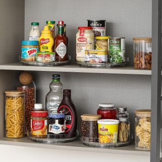 Kitchen shelf with food items on rotating trays