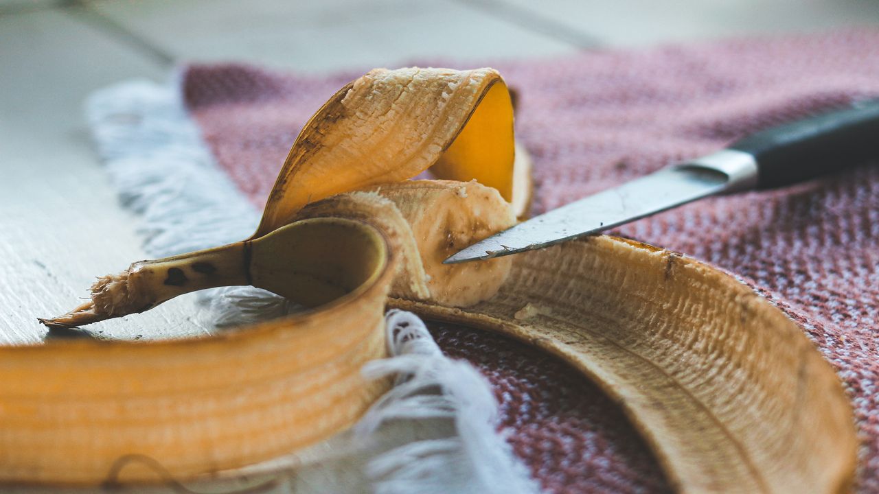 A peeled banana on kitchen table