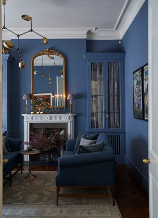 Blue living room with navy blue sofas and lighter blue walls