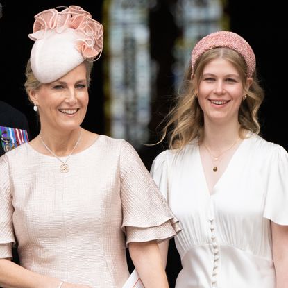 Duchess Sophie and Lady Louise wearing pink dresses and hats smiling at the Platinum Jubilee in 2022