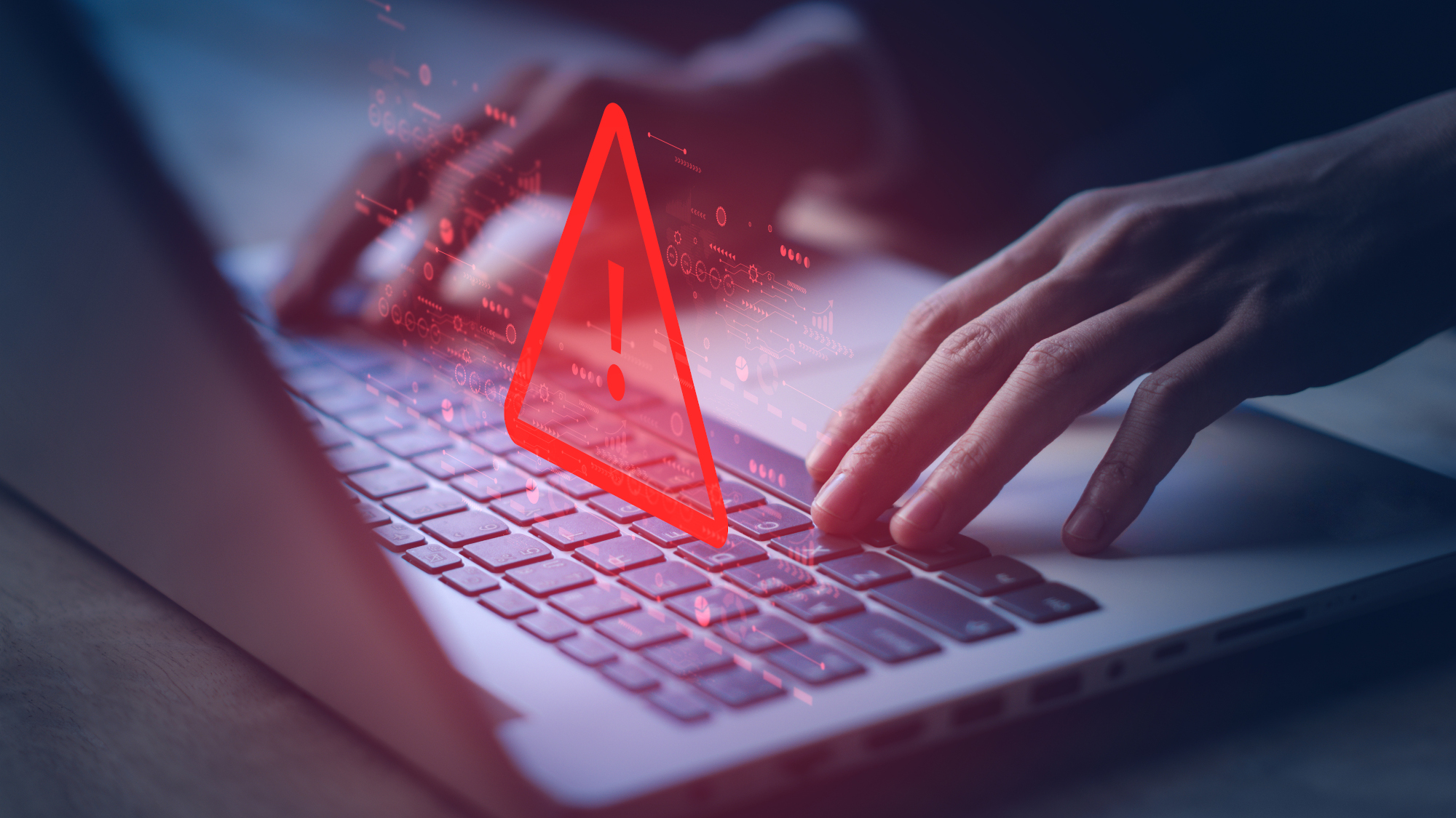 A laptop keyboard with a warning sign graphic hovering above