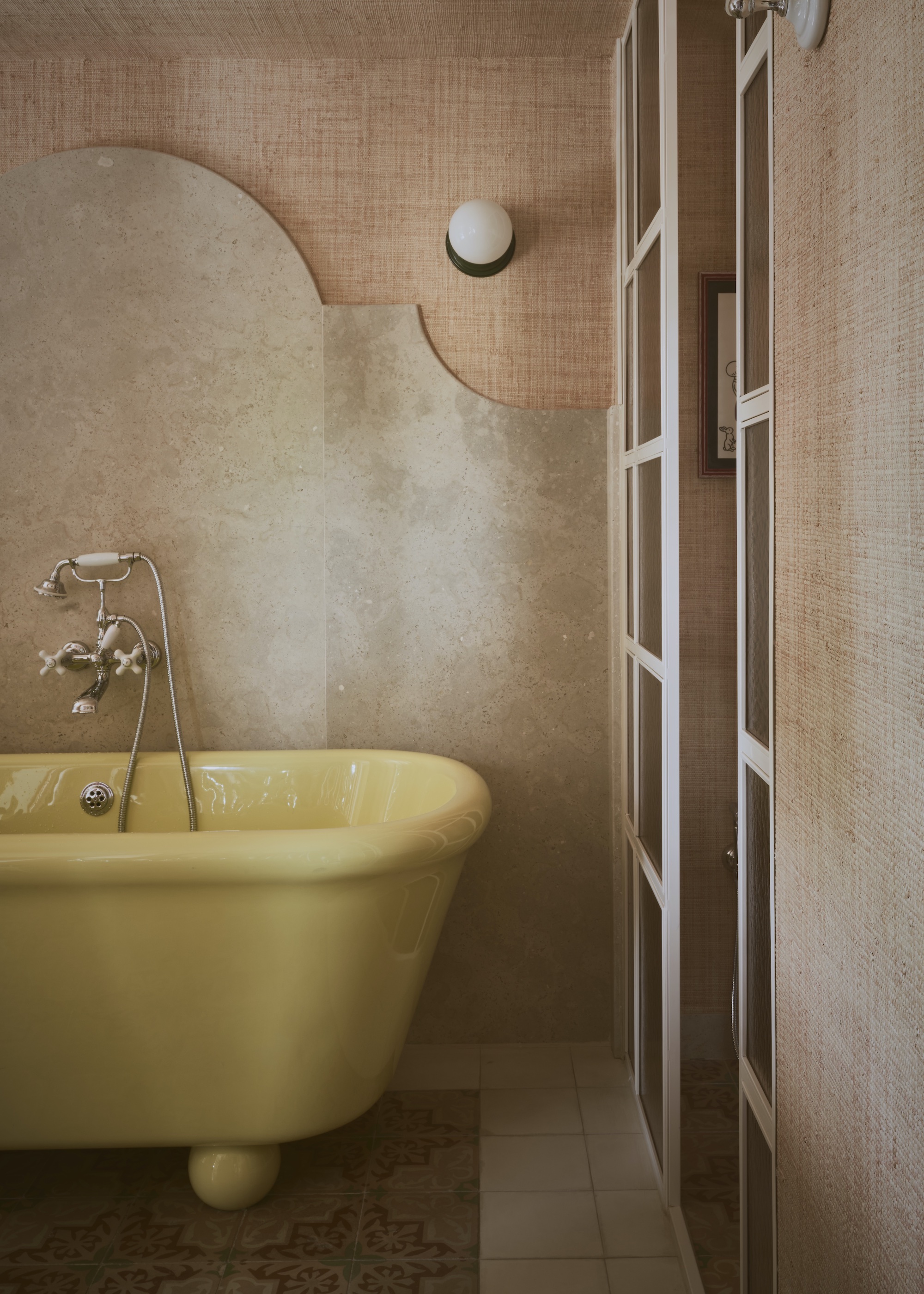 small ensuite bathroom with yellow bath