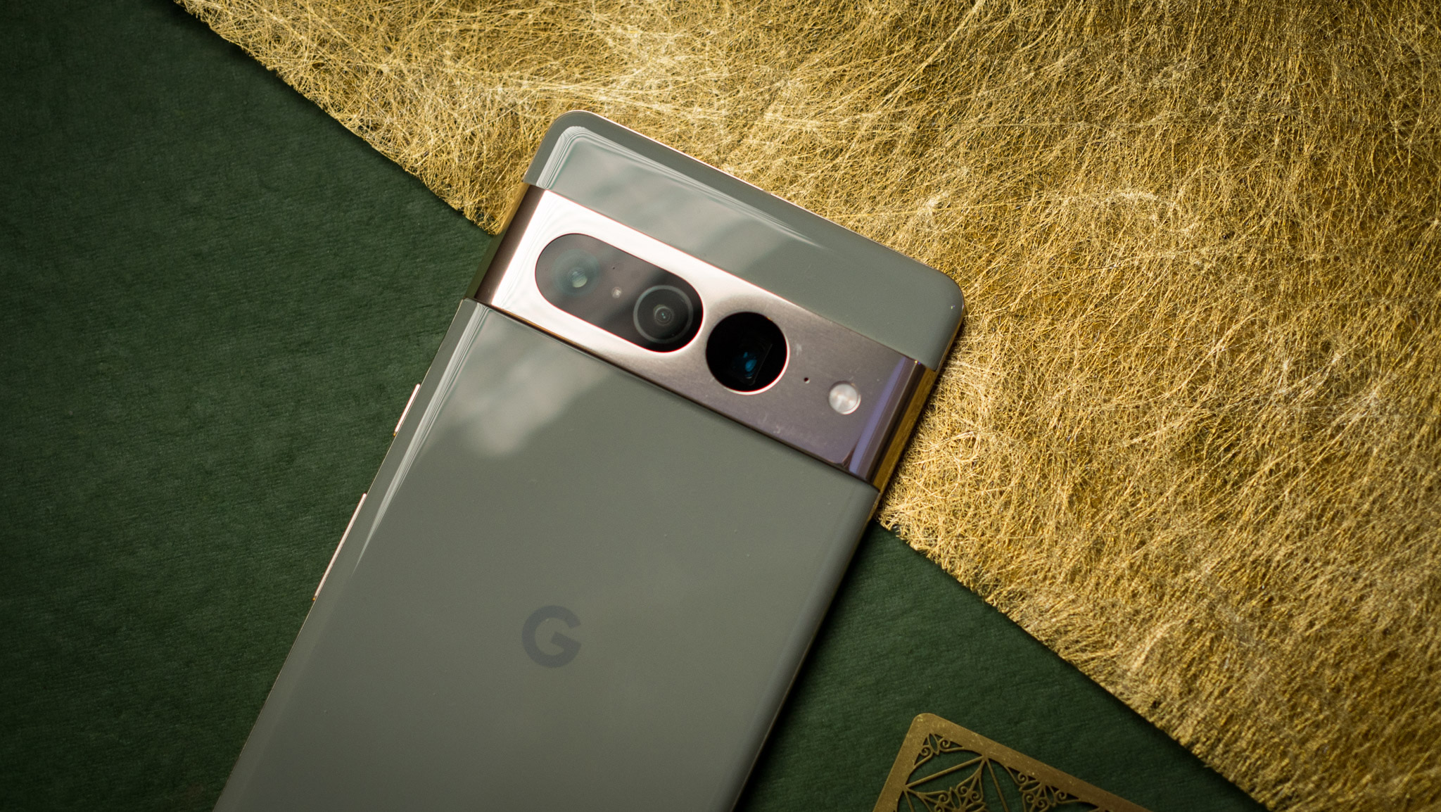 Google Pixel 7 Pro back view with camera bar highlighted on green background